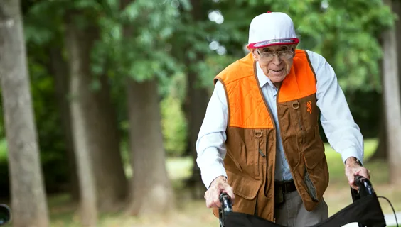 Elderly man with walking aid
